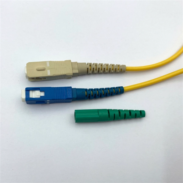 Separated by a wall from the communication fiber optic cable well
